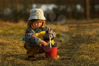 Royalty Free Photo of a Little Girl Playing in a Field