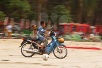 Royalty Free Photo of a Boy on a Motorbike
