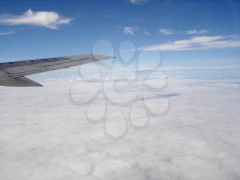 Royalty Free Photo of Cloud Cover From Above and an Airplane Wing