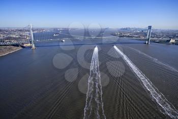 Royalty Free Photo of an Aerial View of New York City's Verrazano-Narrow's Bridge With Boats in Waters