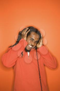 Royalty Free Photo of a Man Listening to Music Through Headphones