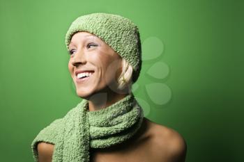Royalty Free Photo of a Smiling Woman Wearing a Hat and Scarf