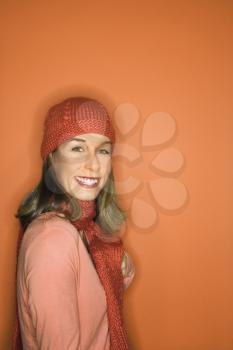 Royalty Free Photo of a Woman Wearing a Hat and Scarf