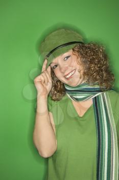 Royalty Free Photo of a Smiling Woman Wearing a Green Hat