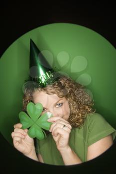 Royalty Free Photo of a Woman Wearing a Party Hat and Shamrock