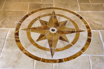 Royalty Free Photo of a Marble Floor With a Star Shape in an Affluent Home