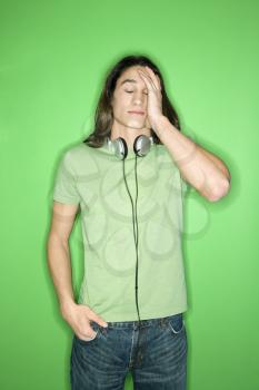 Royalty Free Photo of a Teen Boy With Headphones Around His Neck