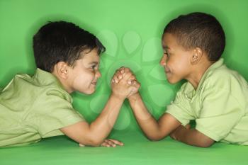 Royalty Free Photo of Two Boys Arm Wrestling 