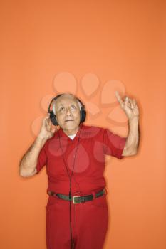 Royalty Free Photo of an Older Man Wearing Headphones