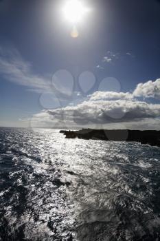 Royalty Free Photo of the Sun Shining on the Coastline With Pacific Ocean on Maui, Hawaii