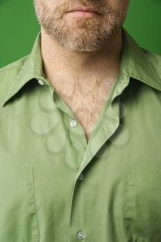 Royalty Free Photo of a Close-up of Man's Face With a Beard and Shirt With Collar Open