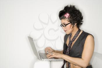 Royalty Free Photo of a Trendy Woman on a Laptop