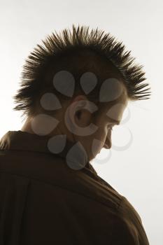 Royalty Free Photo of a Profile of a Man with a Mohawk