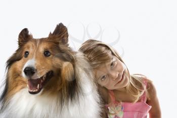 Royalty Free Photo of a Little Girl Sitting With a Collie Dog