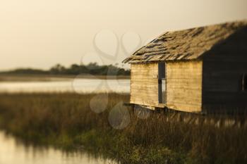 Royalty Free Photo of a Worn Out Building in a Marsh on Bald Head Island, North Carolina
