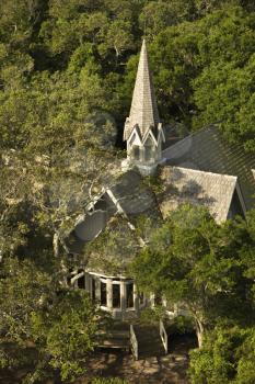 Royalty Free Photo of an Aerial View of a Church Surrounded by Trees on Bald Head Island, North Carolina