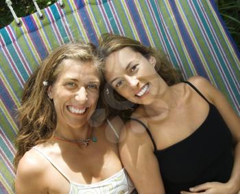 Royalty Free Photo of Women Lying in a Hammock and Smiling