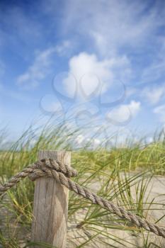 Royalty Free Photo of a Rope Fence Barrier on a Beach