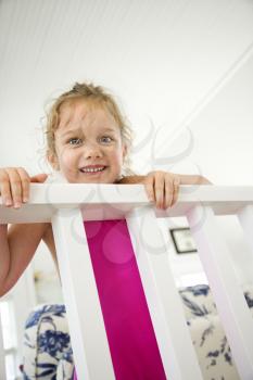Royalty Free Photo of a Child Peeking Over a Railing