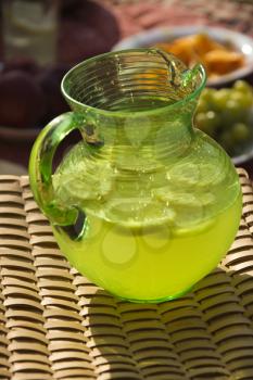 Royalty Free Photo of a Pitcher of Lemonade With Sliced Lemons