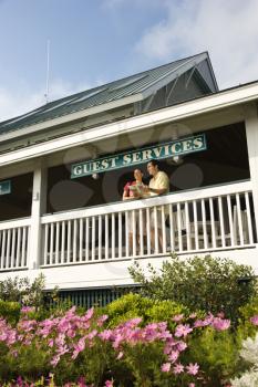 Royalty Free Photo of a Couple on a Deck of Guest Services at Bald Head Island, North Carolina