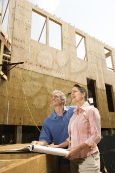 Royalty Free Photo of a Couple in a Building Construction Site