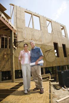 Royalty Free Photo of a Couple in a Building Construction Site