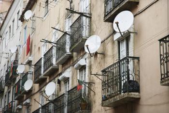 Royalty Free Photo of an Apartment Building With Satellite Dishes in Lisbon, Portugal