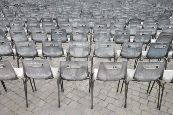 Royalty Free Photo of a Close-up Shot of Several Chairs in Saint Peter's Square in Vatican City, Italy