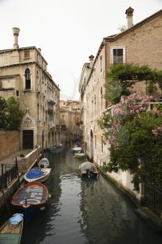 Royalty Free Photo of a Canal with Boats and Buildings in Venice, Italy