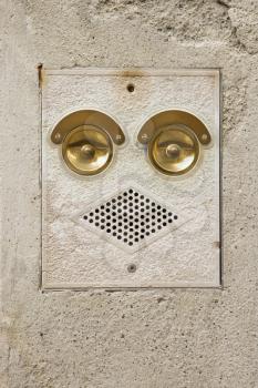 Royalty Free Photo of a Ringer and Speaker That Look Like a Face in Venice, Italy