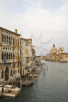 Royalty Free Photo of Buildings and Boats on a Canal in Venice, Italy