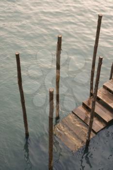 Royalty Free Photo of Steps Leading From a Canal in Venice, Italy