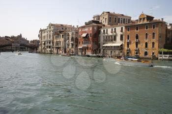 Royalty Free Photo of Buildings and Boats on a Canal in Venice, Italy