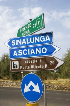 Royalty Free Photo of Road Signs Pointing in Different Directions in Tuscany, Italy