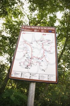 Royalty Free Photo of a Sign With a Map Showing Routes in Tuscany, Italy