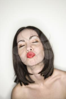 Royalty Free Photo of a Woman Puckering Her lips
