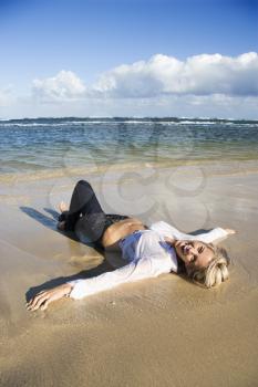 Royalty Free Photo of a Blond Woman Lying on a Maui, Hawaii Beach
