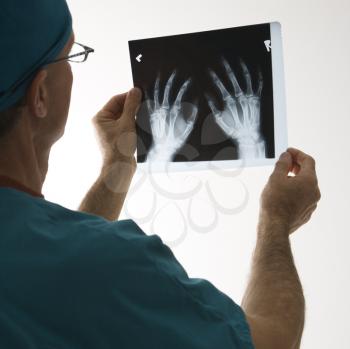 Royalty Free Photo of a Male Doctor Holding an X-ray