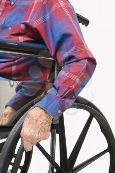 Royalty Free Photo of a Torso Shot of an Elderly Man Sitting in a Wheelchair