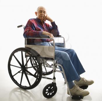 Royalty Free Photo of an Elderly Man Sitting in a Wheelchair