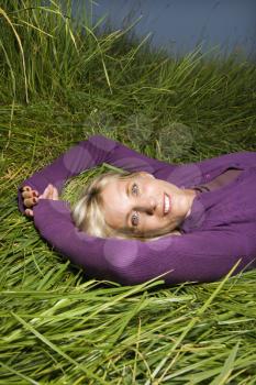 Royalty Free Photo of a Middle-aged Woman Lying in the Grass