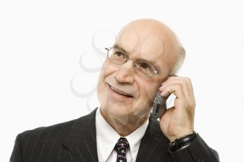 Royalty Free Photo of a Middle-Aged Businessman Talking on a Cellphone Smiling
