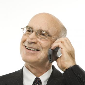 Royalty Free Photo of a Caucasian Businessman Talking on a Cellphone Smiling