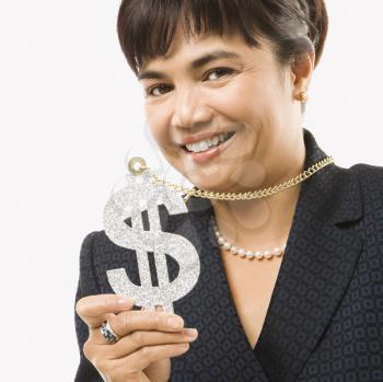 Smiling Filipino middle-aged businesswoman wearing chain necklace with oversized dollar sign.