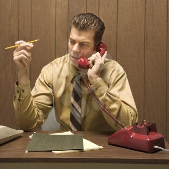 Royalty Free Photo of
a Businessman Talking on a Telephone