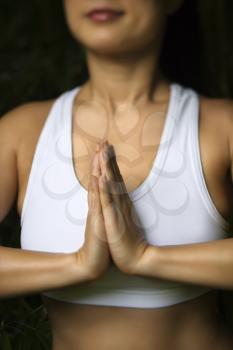 Royalty Free Photo of a Woman in Fitness Attire Standing in a Yoga Position