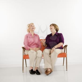 Royalty Free Photo of Older Women Sitting and Laughing