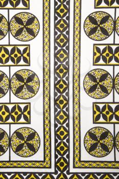 Royalty Free Photo of a Close-up of vintage fabric with black and yellow shapes and patterns printed on polyester