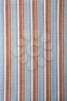 Royalty Free Photo of a Close-up of Woven Vintage Fabric With Blue and Brown Stripes on Cotton